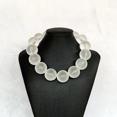 This super chunky necklace was hand beaded using extra large 30mm round frosted clear acrylic beads... a definite WOW statement!  This necklace measures approximately 19 inches in length and is securely fastened with a silver clasp.  A fun, modern look! Enter my shop here to find more fabulous jewelry: https://www.etsy.com/shop/jewelbytessyla View the positive feedback I've received from customers and check out some beautiful art prints for nursery and home at my print shop, Tessyla: https://www Luxury Statement Beaded Necklaces With Large Beads, White Round Resin Necklaces, White Resin Round Necklaces, Big Beads Necklace, Big Bead Necklace, Large Bead Necklace, Clear Necklace, Necklace Big, Necklace Chunky