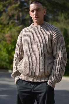 Campfire mens sweater. Super soft and skin friendly wool blend chunky material (40%wool/60% acrylic) that allows machine wash. Unisex fit yet the provided sizing is mens`. Can be knitted to custom measurements and colours.Please contact us with details. The man modeling is size Large and is modeling a sweater size Large.Please note that the knit pattern is slightly stretchy and the sweater will fit loosely. If you need a different size,or you need custom measurements,please contact us with your request to discuss it. MEASUREMENTS  Size M Length from shoulder : 68cm / 27" Chest width : 54cm / 21" Sleeve from underarm:56cm / 22" Size L Length from shoulder : 68cm / 27" Chest width : 58cm /23 " Sleeve from underarm: 58cm /23 " Size XL Length from shoulder : 71cm / 28" Chest width : 66cm /26" Fishermans Rib, Chunky Hand Knit, Mens Crewneck, Rib Sweater, Fisherman Sweater, Mens Sweater, Knit Turtleneck, Knit Turtleneck Sweater, Knitwear Men