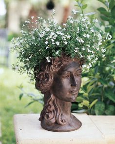 a vase with flowers in it sitting on a table