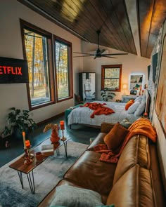 a living room filled with furniture and windows