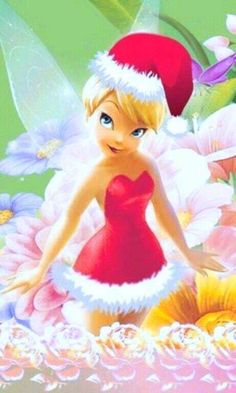 the tinkerbell fairy is standing in front of flowers with her hand on her hip