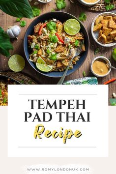 tempeh pad thai recipe on a wooden table with limes and other ingredients