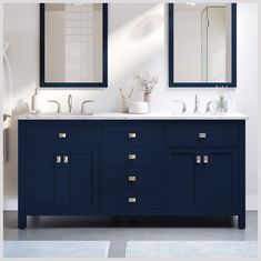 a bathroom with two sinks and mirrors on the wall above them is shown in white and blue