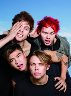 three young men with red hair are posing for the camera and making silly faces while covering their eyes