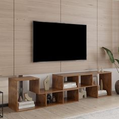 a large flat screen tv mounted to the side of a wall in a living room