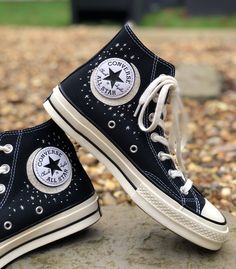 These custom Converse trainers are embroidered by hand with this delicate moon and stars on the inside on each shoe surrounding the Converse logo badge.  You can choose to have either the Classic Chuck Taylor All star canvas Converse or the Chuck 70 Vintage Canvas Converse.  I only purchase 100% genuine shoes from the official converse website. I then use high quality thread to hand embroider the shoes with your chosen design. Sizes are in standard UK woman's sizes. **Because each pair of trainers are made to order I do not provide refunds if the shoes do not fit, so be sure that you have ordered the correct size.** Please check my processing times before placing an order as it can vary depending on my current workload. However, if you need them in a quicker time frame then don't hesitate Embroidered Converse Stars, Vintage Black Cotton Sneakers, Converse Embroidery Space, Black Cotton Vintage Sneakers, Black High-top Custom Sneakers With Embroidered Logo, Black Converse Embroidery, Embroidered Converse High Tops Black, Black Embroidered Low-top Sneakers, Casual Black Sneakers With Star Print