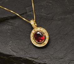 Antique Ruby Pendant set with a Created Ruby in perfect diamond cut, flawless clarity & deep red color, at 10x8mm, 3 Carats, surrounded by CZ Diamonds. Red Vintage Pendant design made of Gold Vermeil ☞ thickest 18k Gold Plating on top of Solid 925 Sterling Silver ☞ made to last. Matching Ring: www.etsy.com/listing/761089210 Matching Earrings: www.etsy.com/listing/963504392 Free Vermeil Chain with every Pendant order, 18 inch Silver chain (46 cm) ✓ Details : ♥ Each item comes in a cute GIFT BOX ✓ Ruby Necklace Gold, Ruby Pendant Set, Blue Topaz Pendant, Ruby Pendant, Deep Red Color, Ruby Necklace, Vintage Pendant, Matching Rings, Red Vintage