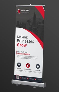 a roll up banner with the words making businesses grow in red and white on it