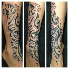 tattoos on the legs and feet are very intricately decorated with swirls, waves, and flowers