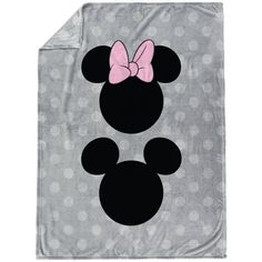 a minnie mouse blanket with a pink bow on the head and polka dot pattern in grey