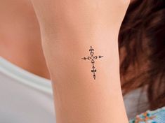 a woman with a small tattoo on her arm