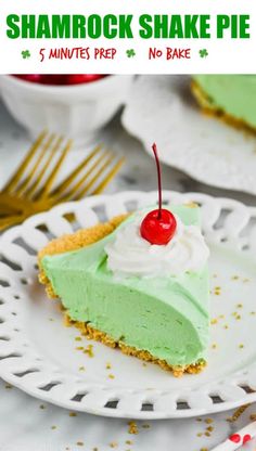 a slice of shamrock shake pie on a white plate with a red cherry in the middle