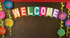 a bulletin board with flowers and the word welcome