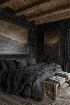 a large bed sitting in a bedroom next to a painting on the wall above it