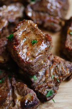 the meat is cooked and ready to be cut into bite sized pieces with parsley on top