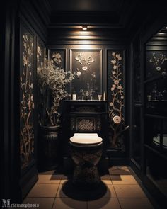 a toilet in a dark room with flowers on the wall and other decorations around it