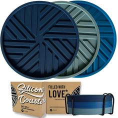 three pizza pans with blue lids and two boxes