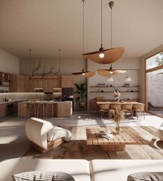 a living room filled with furniture and lots of lights hanging from the ceiling next to an open kitchen