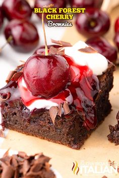 there is a piece of brownie with cherries on it