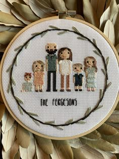 a cross stitch pattern with the words, the fecesons on it in front of some leaves