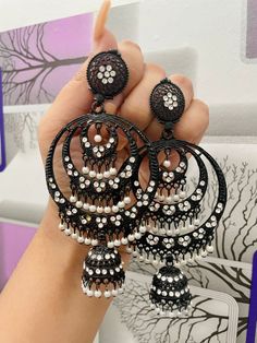 White Jhumkas For Eid Party, Bohemian White Chandbalis For Wedding, White Chandbalis For Eid Party, Festive White Metal Jhumkas, White Bohemian Chandbali Jhumkas, Festive White Metal Chandelier Earrings, White Dangle Chandbalis, White Danglers With Dangling Beads For Festive Occasions, Festive White Danglers With Dangling Beads