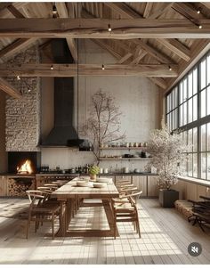 a large wooden table sitting in the middle of a room next to a fire place