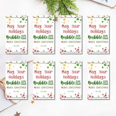 six christmas cards with the words may your holidays be merry on them, surrounded by other holiday decorations