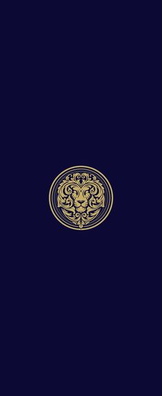 an image of a lion head in the middle of a dark blue background with gold accents