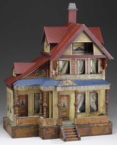 a doll house with many windows and doors