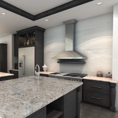 a large kitchen with marble counter tops and black cabinets