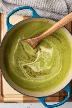 A blue pot filled with rich and creamy asparagus leek soup with thyme. A swirl of cream and black pepper is on top and a wooden spoon sits in the pot. Asparagus Leek Soup, The Best Asparagus, Best Asparagus, Spring Soup Recipes, Spring Soup, Spring Soups, Spring Produce, Creamy Asparagus