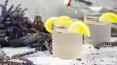 two glasses filled with lemonade and lavender