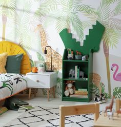 a child's bedroom decorated in green and white