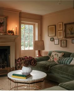 a living room filled with furniture and a fire place