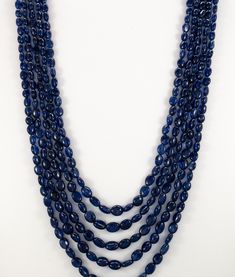 "Adjustable Blue Sapphire oval necklace - multi strand 5 layer smooth bead 6x8 7x9mm jewelry Beaded Necklaces Adjustable Sapphire Necklace Product Details : Name : BLUE SAPPHIRE BEADED NECKLACE Gemstone Name : BLUE SAPPHIRE Chain Style : BEADED Beads Shape : FACETED Oval Beads Size : 6x8 / 7x9 mm Approx. Length : 16\"-18\" Inch Approx. Weight : 570 Cts. Customization : **Available** Please Feel Free To Contact If You Have Any Query." Luxury Blue Oval Beads Jewelry, Luxury Blue Necklace With Spacer Beads, Cheap Blue Beaded Necklaces With Large Beads, Luxury Blue Beaded Necklace With Large Beads, Cheap Blue Beaded Necklace With Black Beads, Luxury Blue Beaded Necklaces With Large Beads, Luxury Blue Beaded Necklace With Silver Beads, Luxury Blue Necklace With 8mm Beads, Luxury Blue Beaded Long Necklace