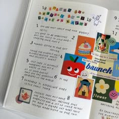 an open notebook with stickers on it