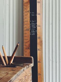 a ruler and pencils are sitting on a table