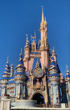 the castle is pink and blue with gold trim