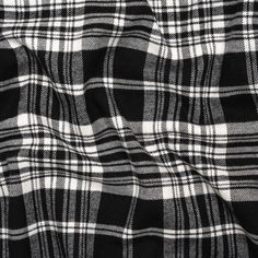 This Black and White Plaid Cotton Twill Flannel is the perfect mix of sophistication and ease, featuring an ultra-soft hand and supple drape.Suggested Projects:  Lightweight Jackets, Shirts, Dresses, SkirtsContent:  100% CottonStretch:  NoneOpacity:  OpaqueBlack and white plaid intermingle across this flannel. With a 100% cotton composition, this fabric underwent a brushed finishing technique, resulting in a fuzzy face and elevating the already soft qualities of flannel. Its medium-weight and su Flannel Texture, Texture Black And White, Discount Fabric Online, Mood Designer Fabrics, Eye In The Sky, Printed Linen Fabric, Black And White Flannel, White Flannel, Tencel Fabric