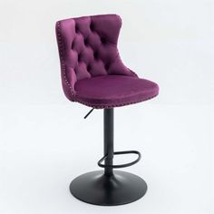 a purple bar stool with studding on the back and foot rests against a white background