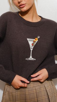 It's tini-time girls! The all new Tini-Time Sweater is a slightly cropped smocked ribbed wrist sweater with the cutest embroidered martini on the front making this sweater perfect with a pair of denim to grab a drink with the girls! Model is 5'7 wearing a size small Runs true to size Slight crop fit Smocked wrist detail Embroidered front martini 52% Acrylic 28% nylon 20% polyester Hand wash cold and hang dry Semi Cropped, Graphic Sweaters, Printed Sweater, Charcoal Color, Martini Glass, Dress Romper, Cropped Sweater, Grey Sweater, Charcoal Grey