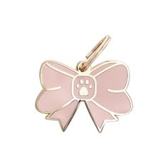 a pink bow shaped dog tag with a paw print on the front and back of it