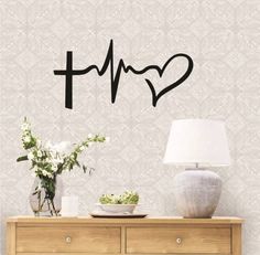 a wall decal with the word love and a heart on it