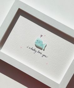 a card with an image of a blue whale in it's frame that says, i probably love you