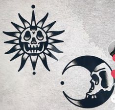 the sun and moon have been stenciled on this concrete wall with black ink