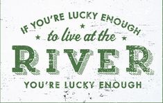 a sign that says if you're lucky enough to live at the river, you're lucky enough