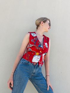 Awesome red nautical vest by Liz Claiborne. The vest is made of rayon and featured with 5 gold tone buttons in XS size . It can be a good mix style with basic tees, statement collar blouses and even just as vest top . In the last photo you can see a few red spots, but they are not noticeable as they look like part of the print.  Condition: In good condition. Some spots on the last picture.  Label: Liz Claiborne petit collection. Material: 100% rayon , lining 100% acetate.  Size: P ( XS) but can Retro Red Sleeveless Vest, Red Sleeveless Retro Vest, Fitted Red Vest With Buttons, Vintage Red Vest Top, Vintage Red Vest For Summer, Red Vintage Vest For Summer, Red Vintage Summer Vest, Fitted Red Tops With Snap Buttons, Red Sleeveless Vest With Buttons