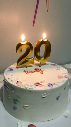 a birthday cake with the number twenty two candles lit