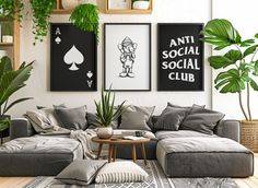 a living room filled with lots of furniture and plants on the wall next to it