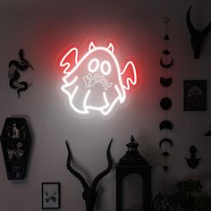 a neon sign that is on the side of a wall